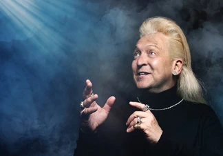 Light beams shining down on Clinton Baptiste.