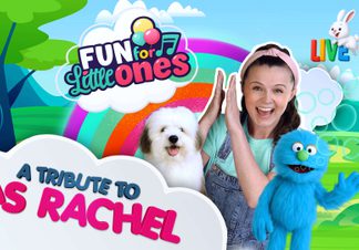 Woman with dog and a blue puppet in front of a rainbow.