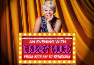 Crissy Rock smiling into the camera.