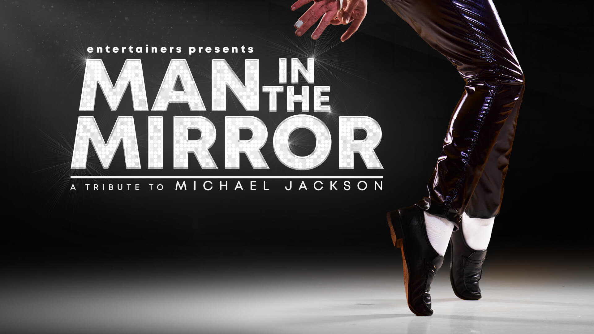 Pair of legs with black trousers, white socks and black shoes next to title treatment.