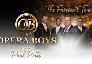 Five men wearing suits smiling, with theatre in the background.