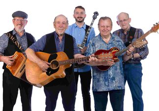 Five men, all holding musical instruments, smiling.