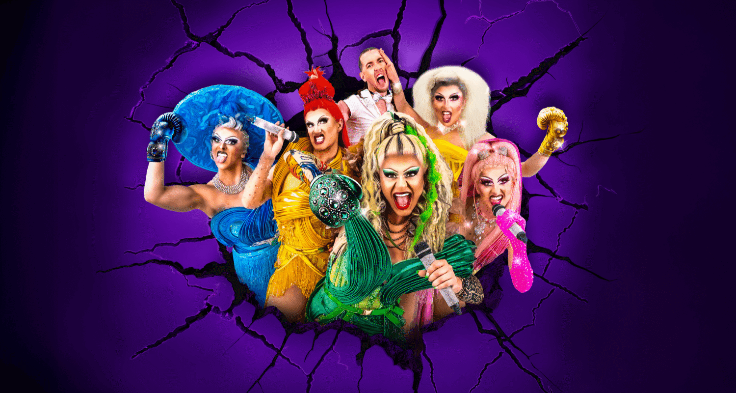 Five drag queens posing with one man in the background.