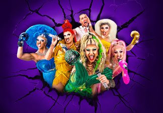 Five drag queens posing with one man in the background.